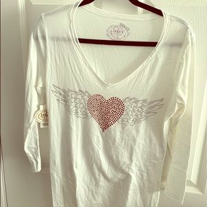 White T shirt with hearts.